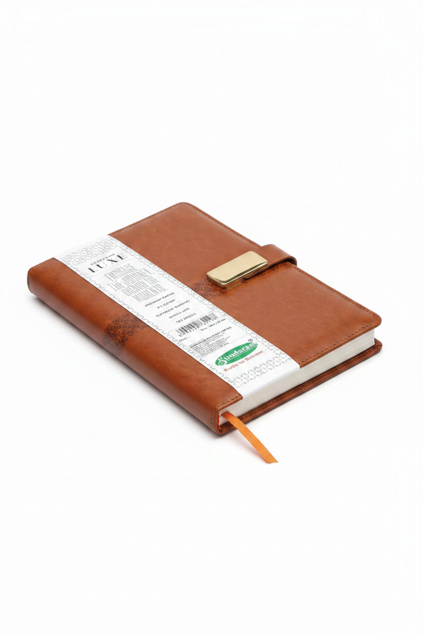 A brown leather planner or notebook cover with a gold-tone metal clasp and a white paper band label, shown on a plain white background.